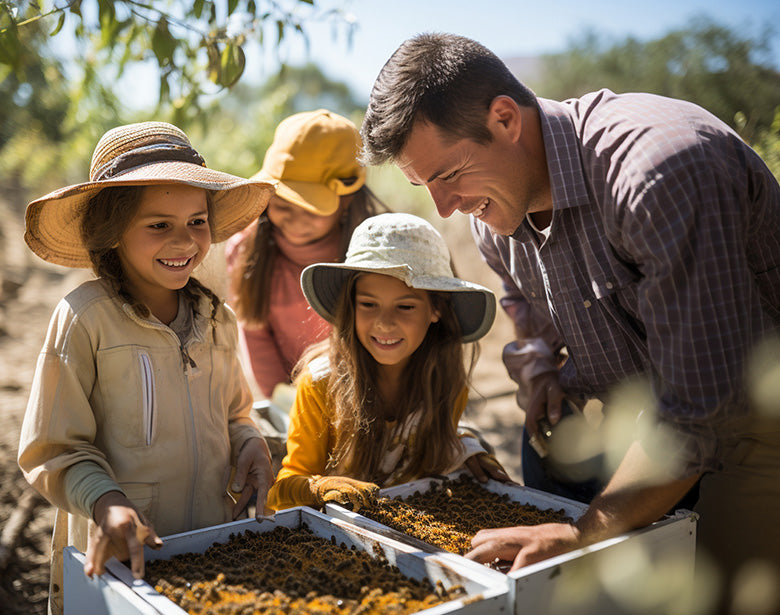 Young children inspect bee hives under the supervision of an adult.