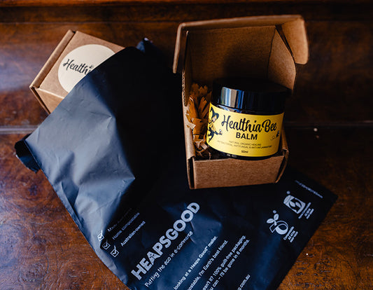 A jar of Healthia Bee Balm with its HeapsGood packaging.